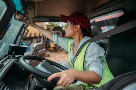 truck driver adjusting mirrors